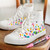 A lifestyle image of Posca PC-3M Fine Tip Paint Markers in use on a shoe.